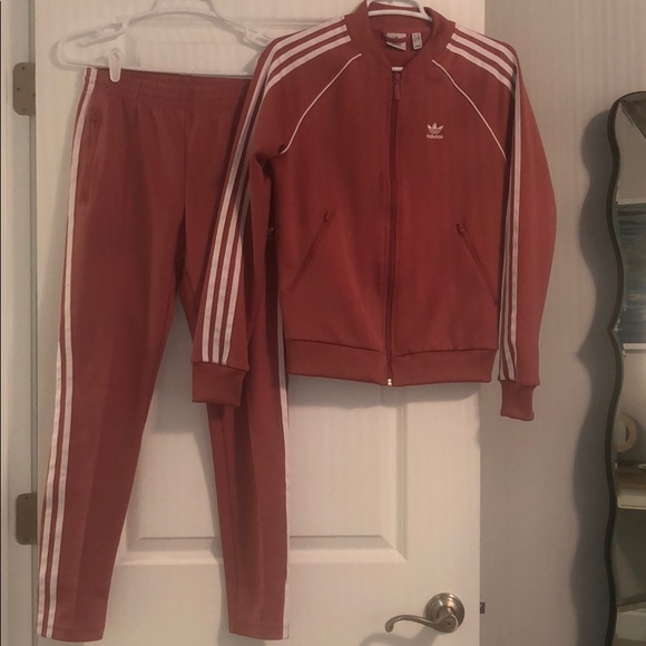 red adidas pants and jacket